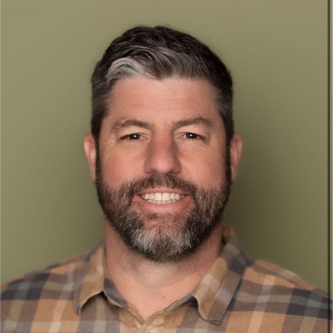 Josh Thurmond, studio headshot, olive background